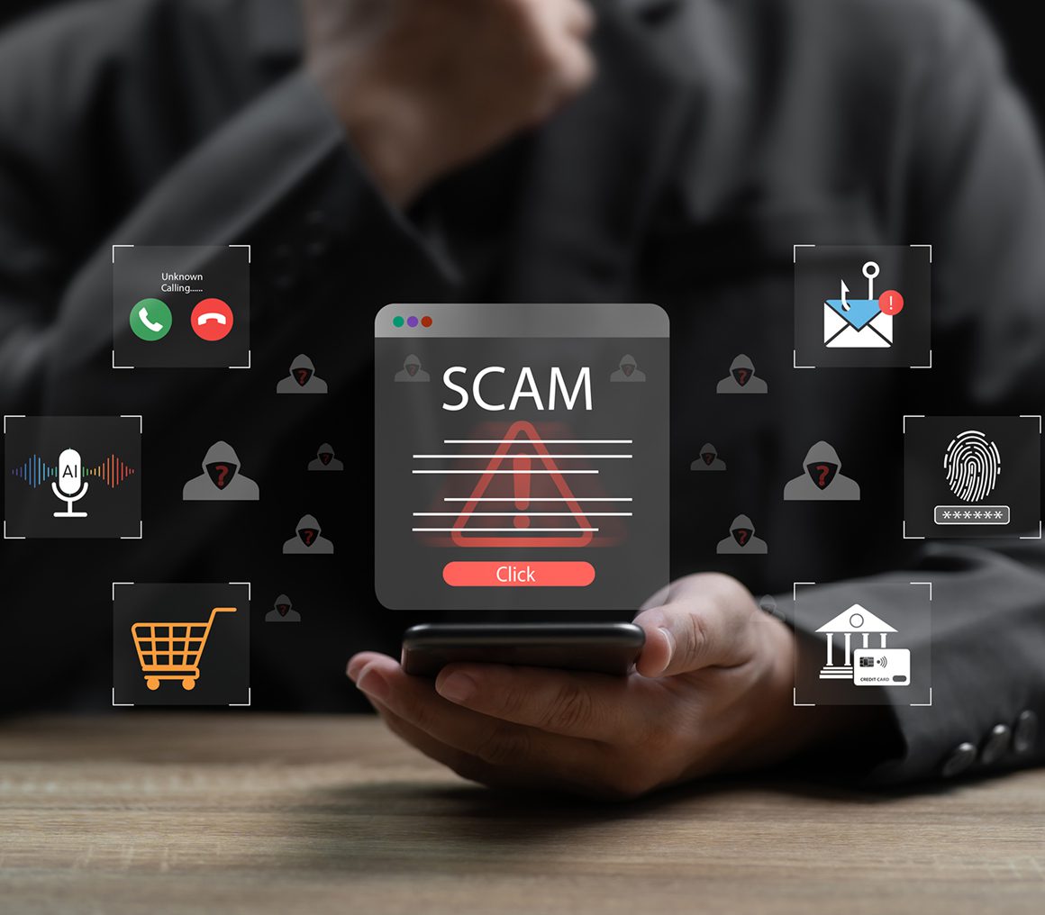 Man holding phone with scam warning