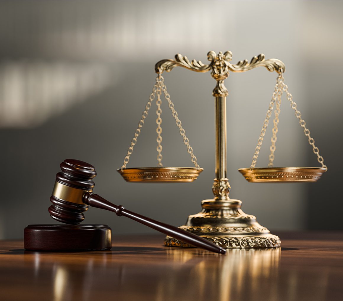 Symbolic justice scales with wooden gavel